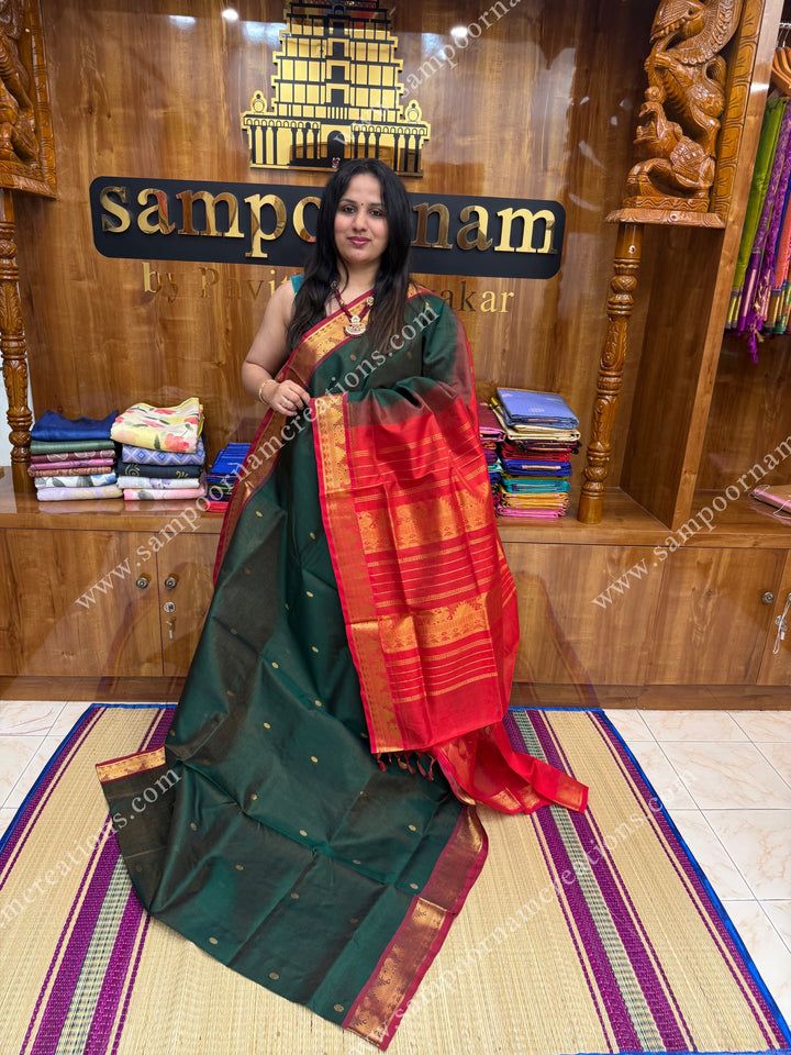 Green with Red , Zari butta in the body with  Vairaoosi Zari lines , traditional borders  and rich Pallu Silk Cotton Saree