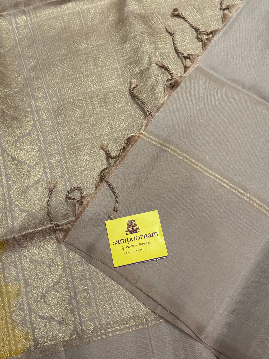 Musturd with Beige  , rich Annam and chakram  zari butta in the body and an elaborate rich Pallu Pure Soft Silk Saree