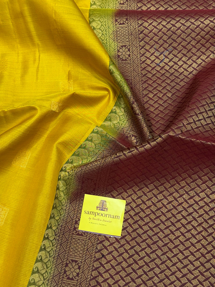 Manjal With Maroon,  traditional rettapet border, rich zari butta in the body and grand pallu Pure Soft Silk Saree