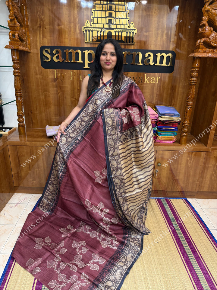 Maroon with Cream saree with Hand Painted leaf designs in the body and Paisley Prints in the border and Pallu ,  Pure Tussar Silk Saree