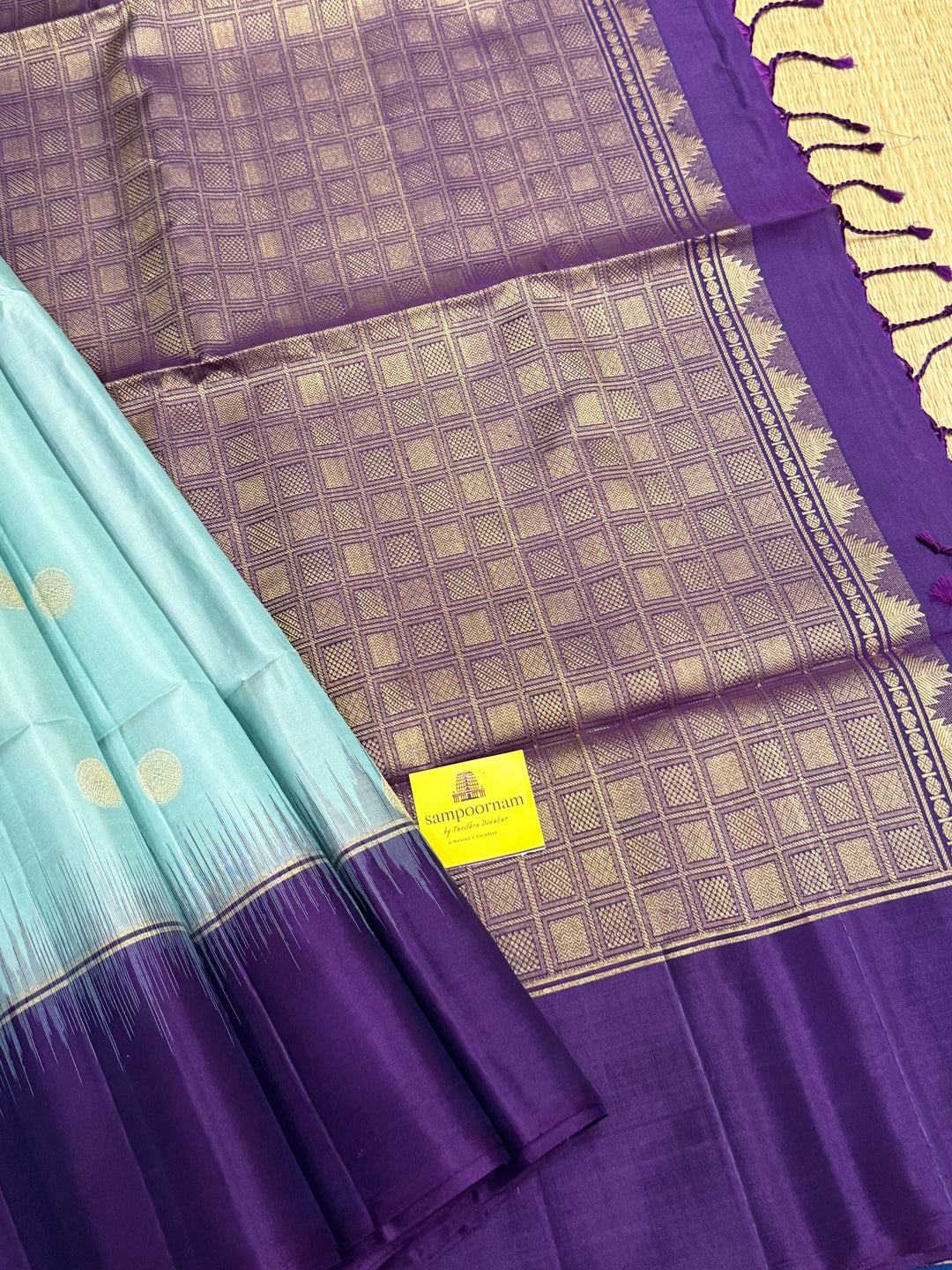 Ice Blue with Indigo, rich Rudraksha zari butta in the body and an elaborate rich Pallu Pure Soft Silk Saree