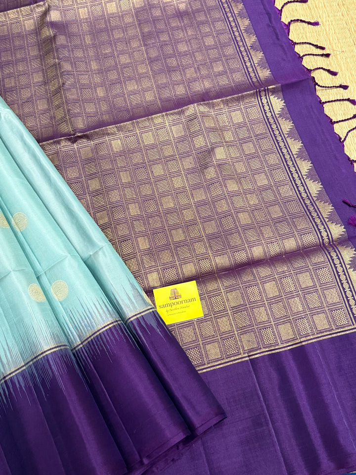 Ice Blue with Indigo, rich Rudraksha zari butta in the body and an elaborate rich Pallu Pure Soft Silk Saree