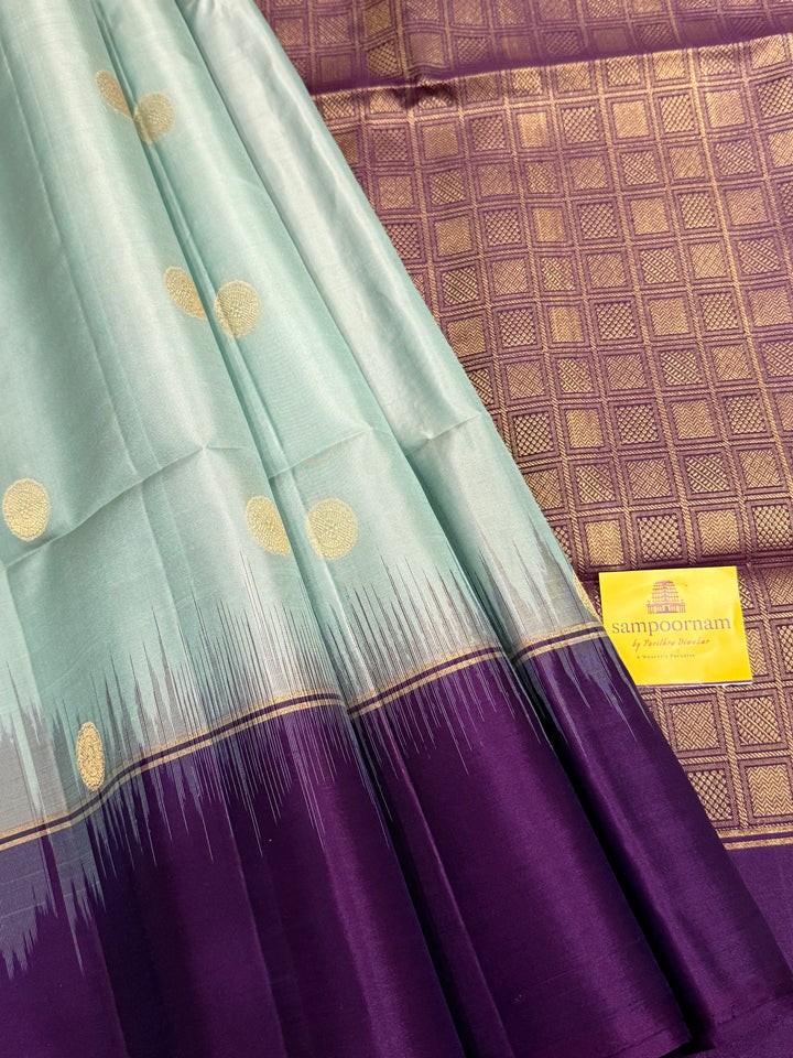 Ice Blue with Indigo, rich Rudraksha zari butta in the body and an elaborate rich Pallu Pure Soft Silk Saree