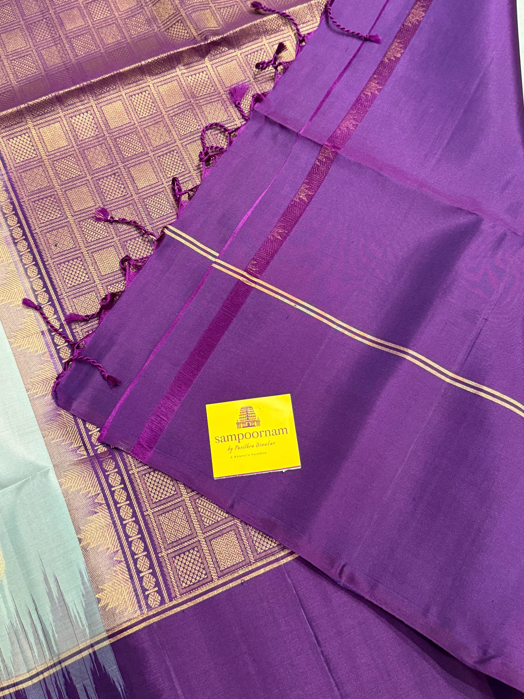 Ice Blue with Indigo, rich Rudraksha zari butta in the body and an elaborate rich Pallu Pure Soft Silk Saree