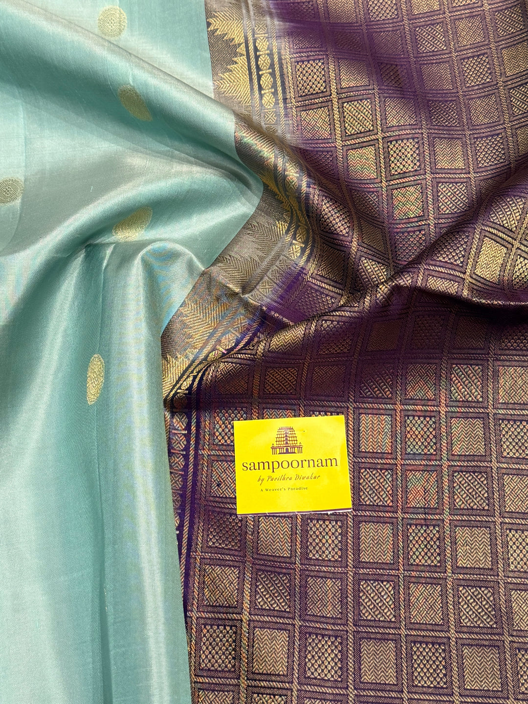 Ice Blue with Indigo, rich Rudraksha zari butta in the body and an elaborate rich Pallu Pure Soft Silk Saree