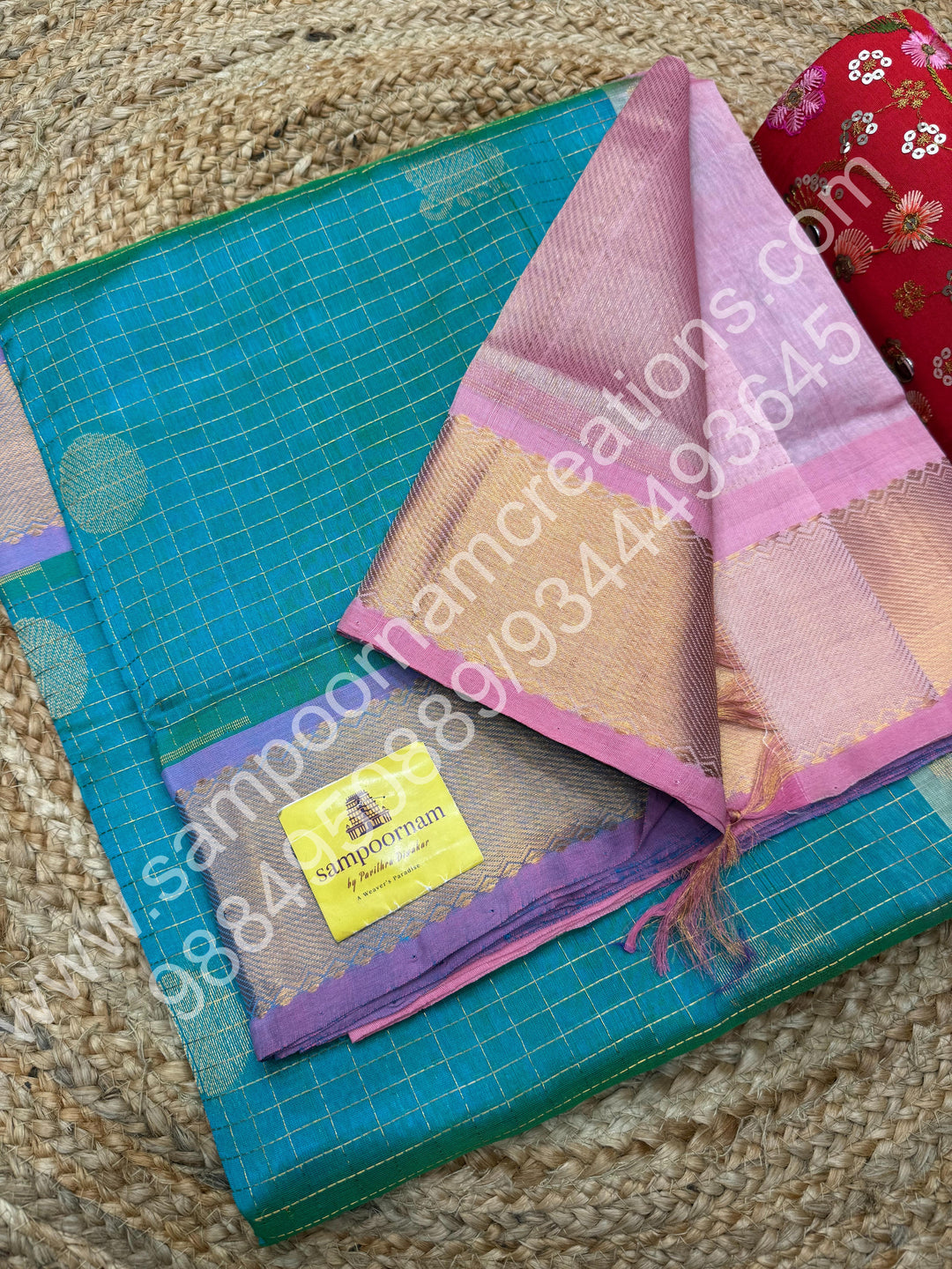 Double Shaded Sea Green with Baby Pink  , Rich Mayil and Chakram butta in the body with Zari Checks , Traditional borders and Rich Pallu Pure Silk Cotton Saree