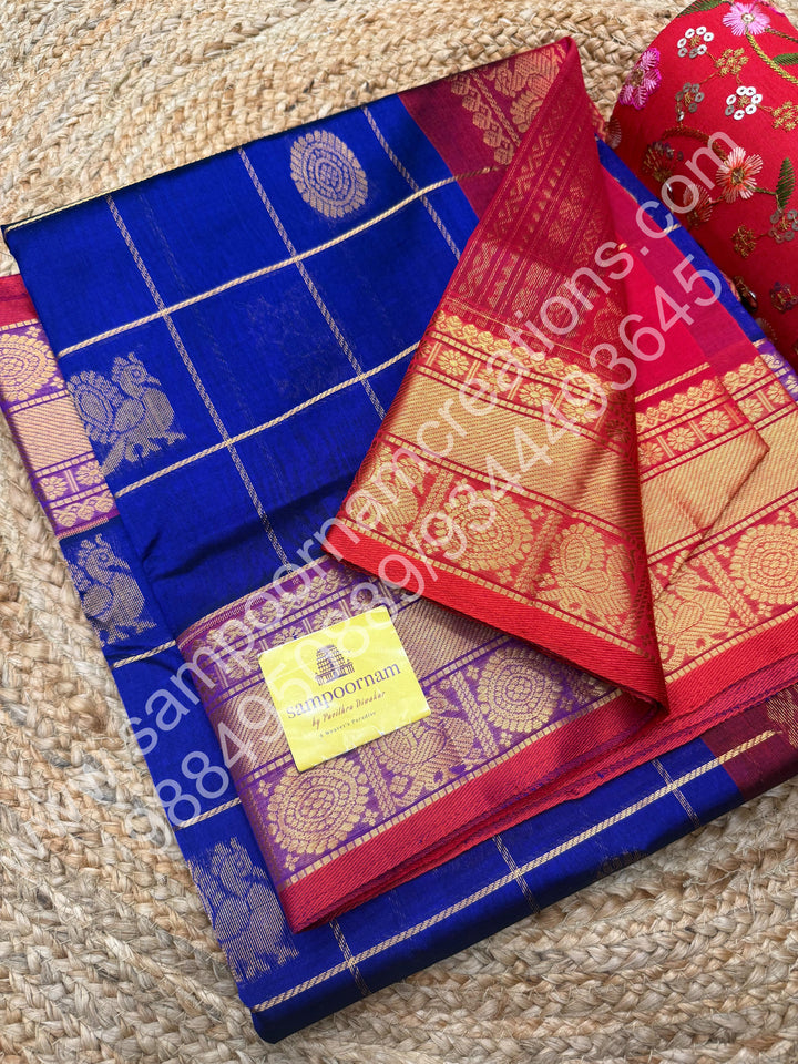 Indigo Blue with Red  , Rich Mayil and Chakram butta in the body with Zari Checks , Traditional borders and Rich Pallu Pure Silk Cotton Saree