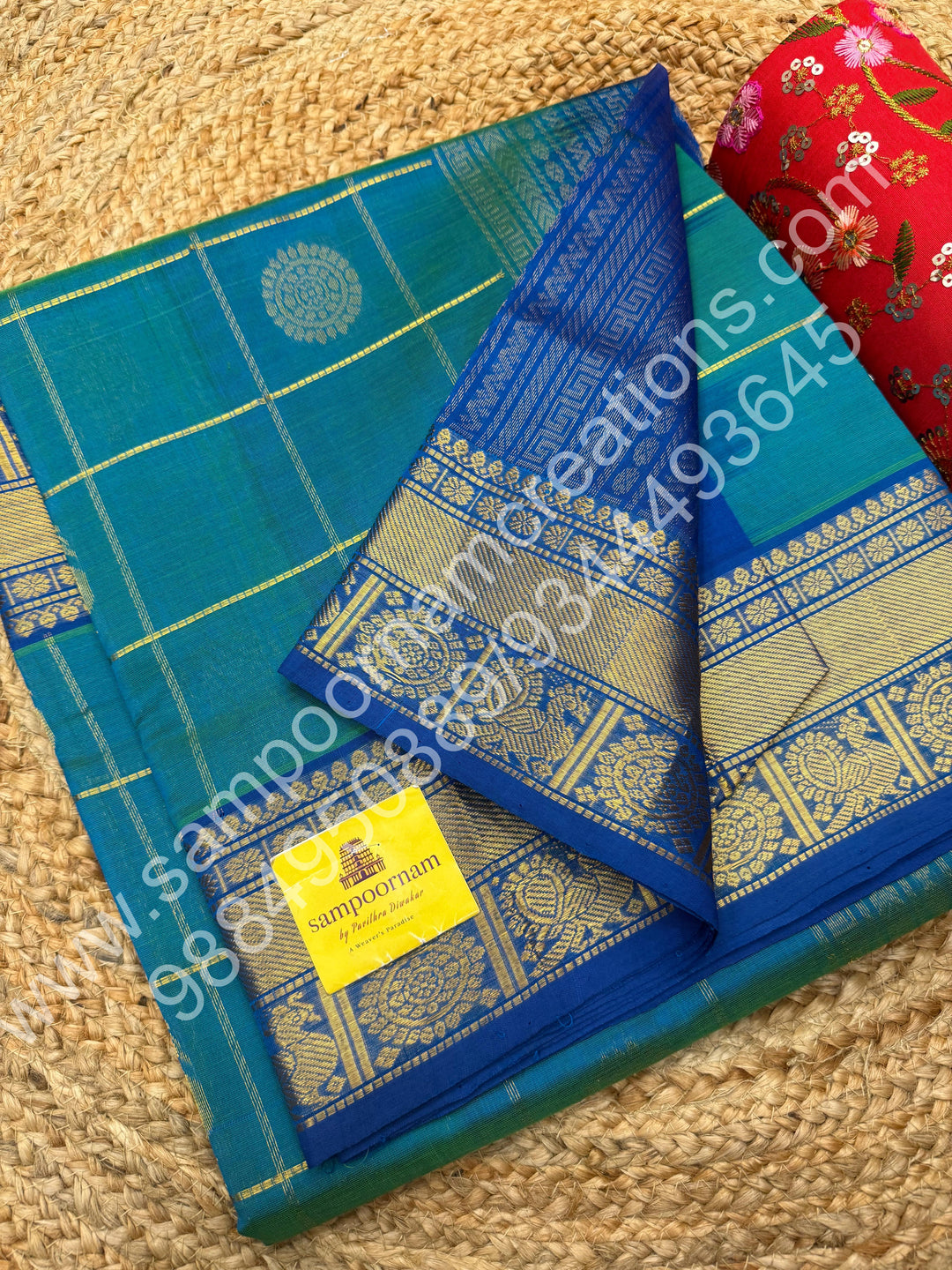 Double Shaded Teel Blue with Blue  , Rich Mayil and Chakram butta in the body with Zari Checks , Traditional borders and Rich Pallu Pure Silk Cotton Saree