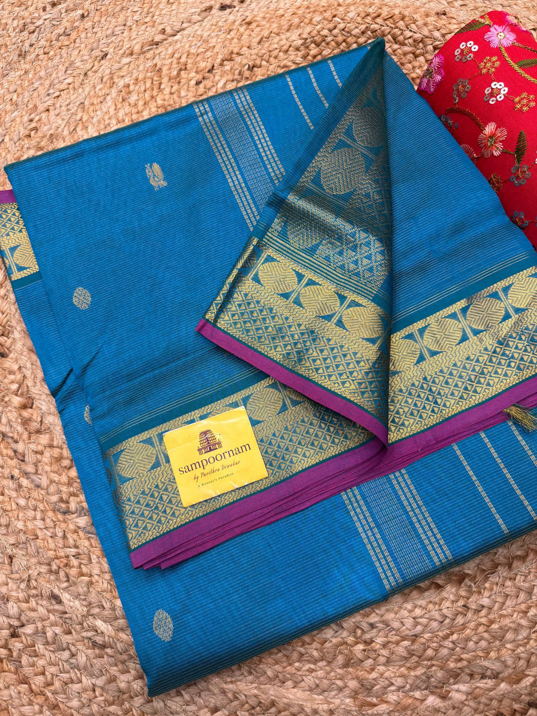 Double Shaded Chinthamani Blue , Pink Selvedge Vairaoosi Zari lines with Rich Annam and Rudraksh  Zari Butta in the body , traditional borders and Rich Pallu Pure Silk Cotton Saree
