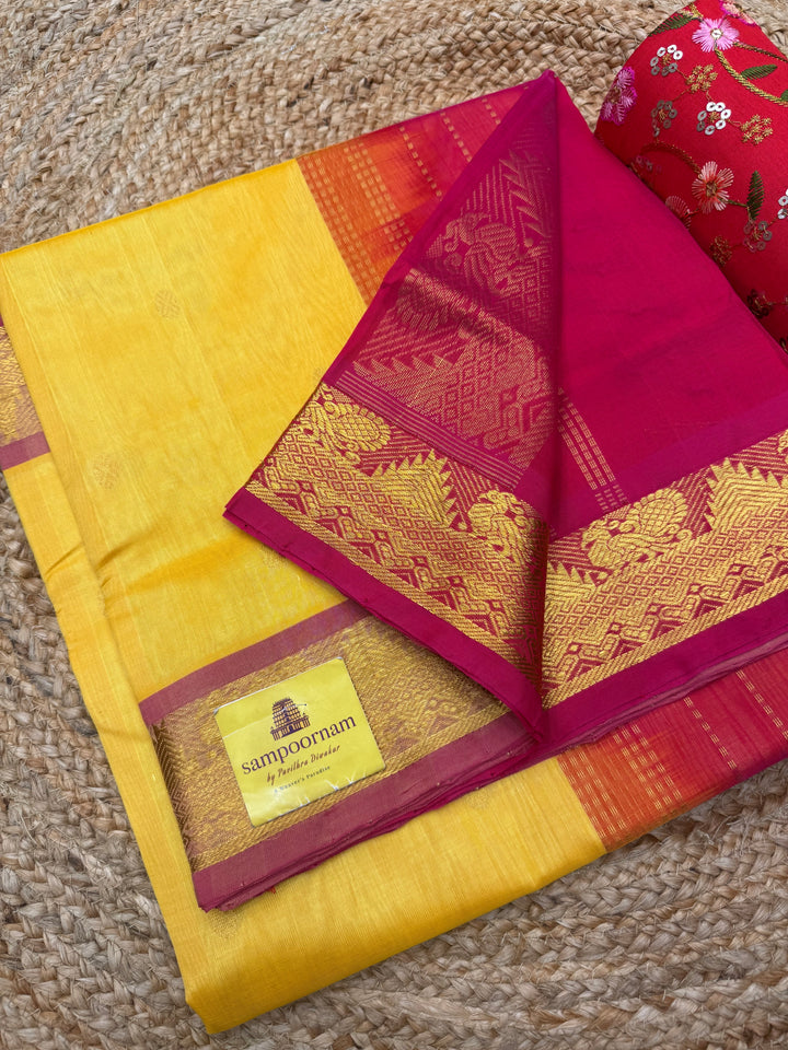 Manjal with Red ,  Rich  Zari Butta in the body , traditional borders and Rich Pallu Pure Silk Cotton Saree