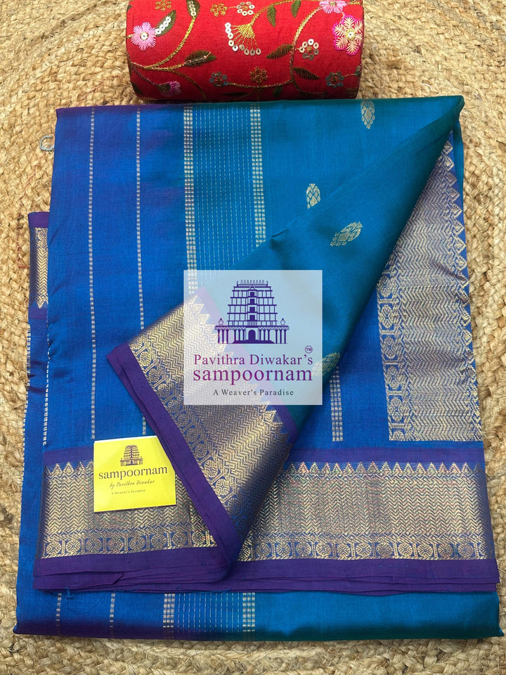 Blue with Mayilkazhuthu Blue  , Zari butta in the body ,   traditional borders and grand Pallu , Ten Yards Silk Cotton Saree