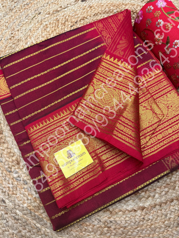 Dark Maroon with Red , Veldhari Zari Lines in the Body , Traditional Kanchi border , Rich Pallu , Pure Silk Cotton Saree