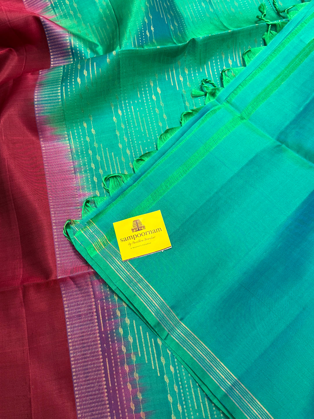 Deep Maroon With Turquoise Blue , rich annam butta in the lower border and small zari buttas in the body, rich Pallu Pure Soft Silk Saree