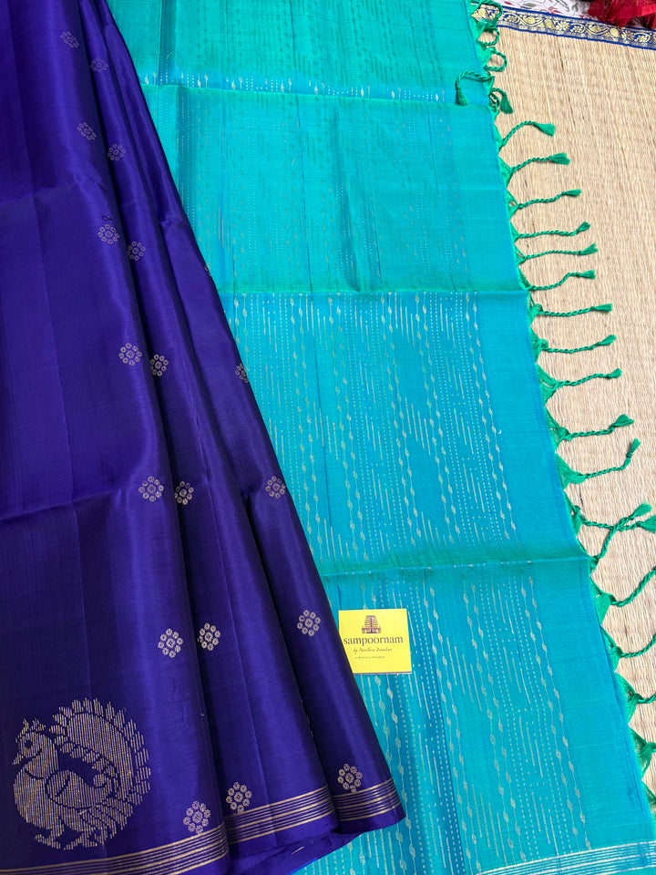 Dark Blue With Turquoise Blue , rich annam butta in the lower border and small zari buttas in the body, rich Pallu Pure Soft Silk Saree