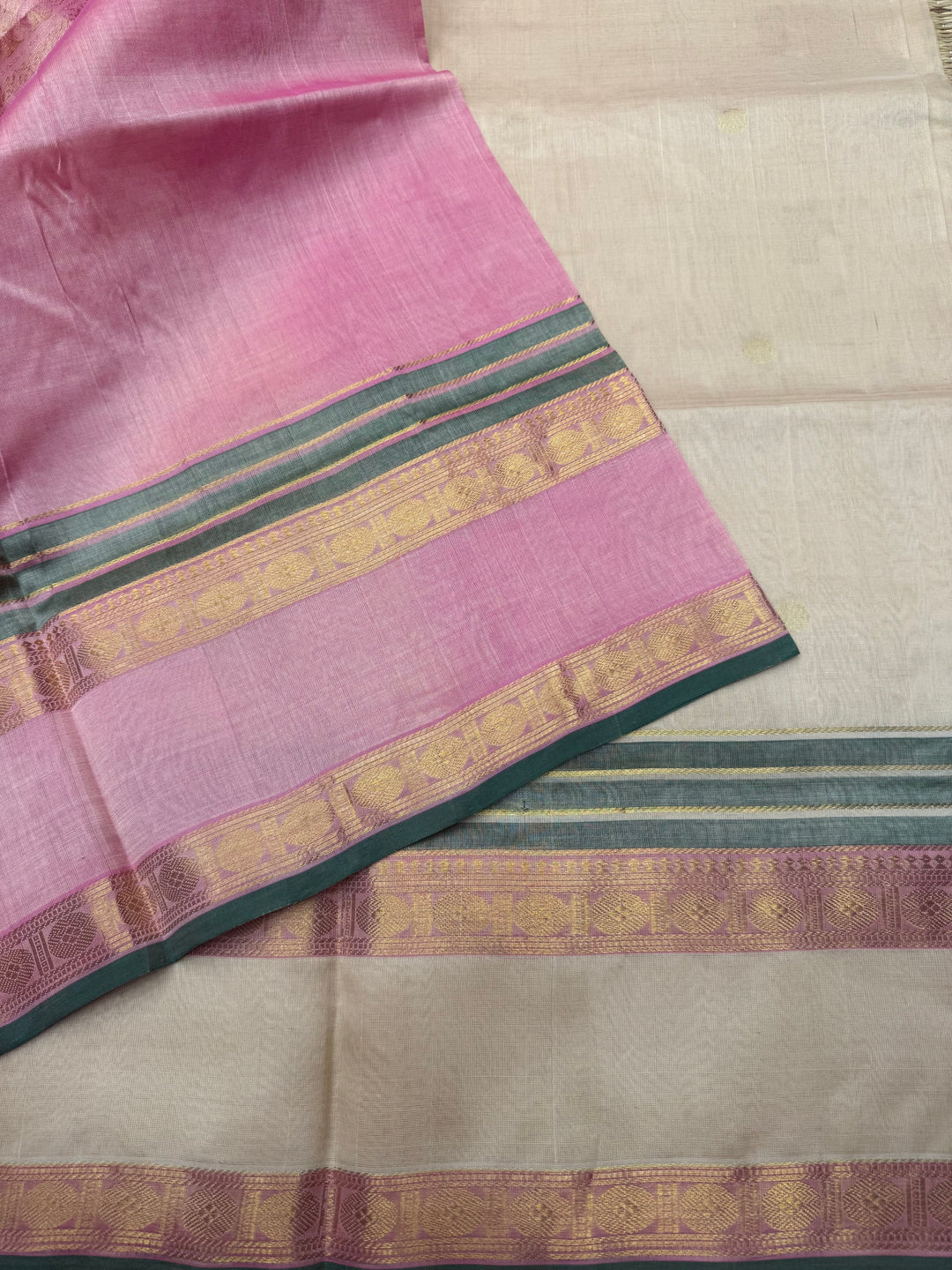 Cream with Baby Pink , Rich Annam and Rudraksh  Zari Butta in the body , Rettapet Rudraksh  borders and Rich Pallu Pure Silk Cotton Saree