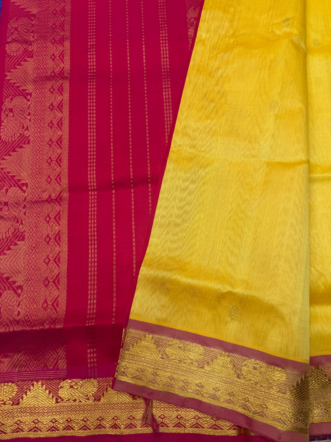 Manjal with Red ,  Rich  Zari Butta in the body , traditional borders and Rich Pallu Pure Silk Cotton Saree