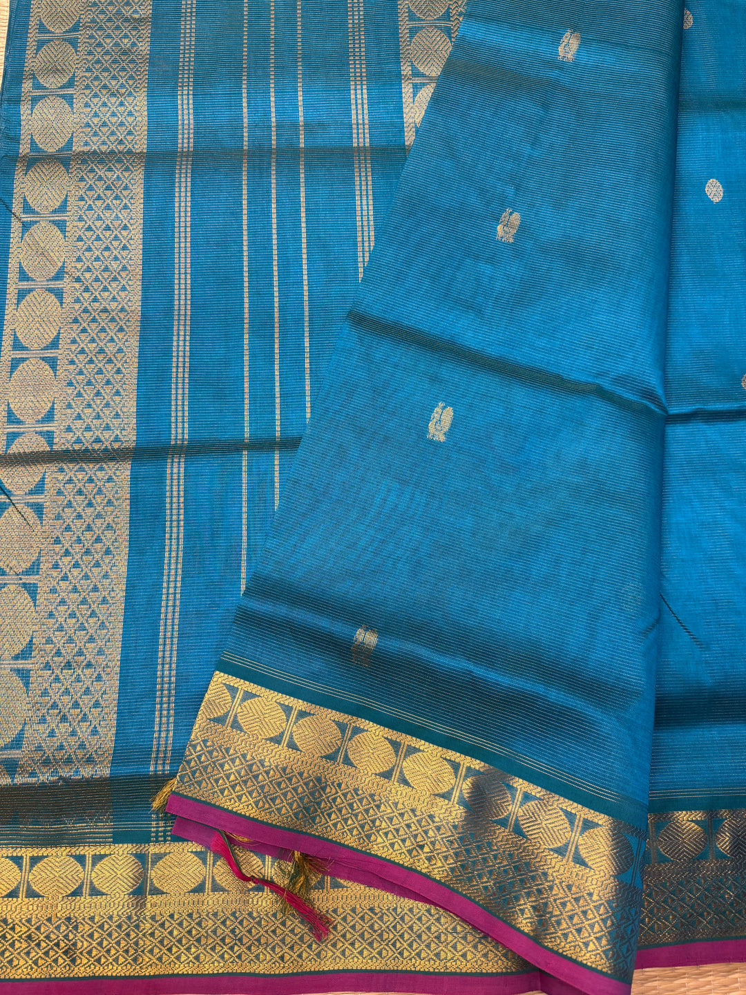 Double Shaded Chinthamani Blue , Pink Selvedge Vairaoosi Zari lines with Rich Annam and Rudraksh  Zari Butta in the body , traditional borders and Rich Pallu Pure Silk Cotton Saree