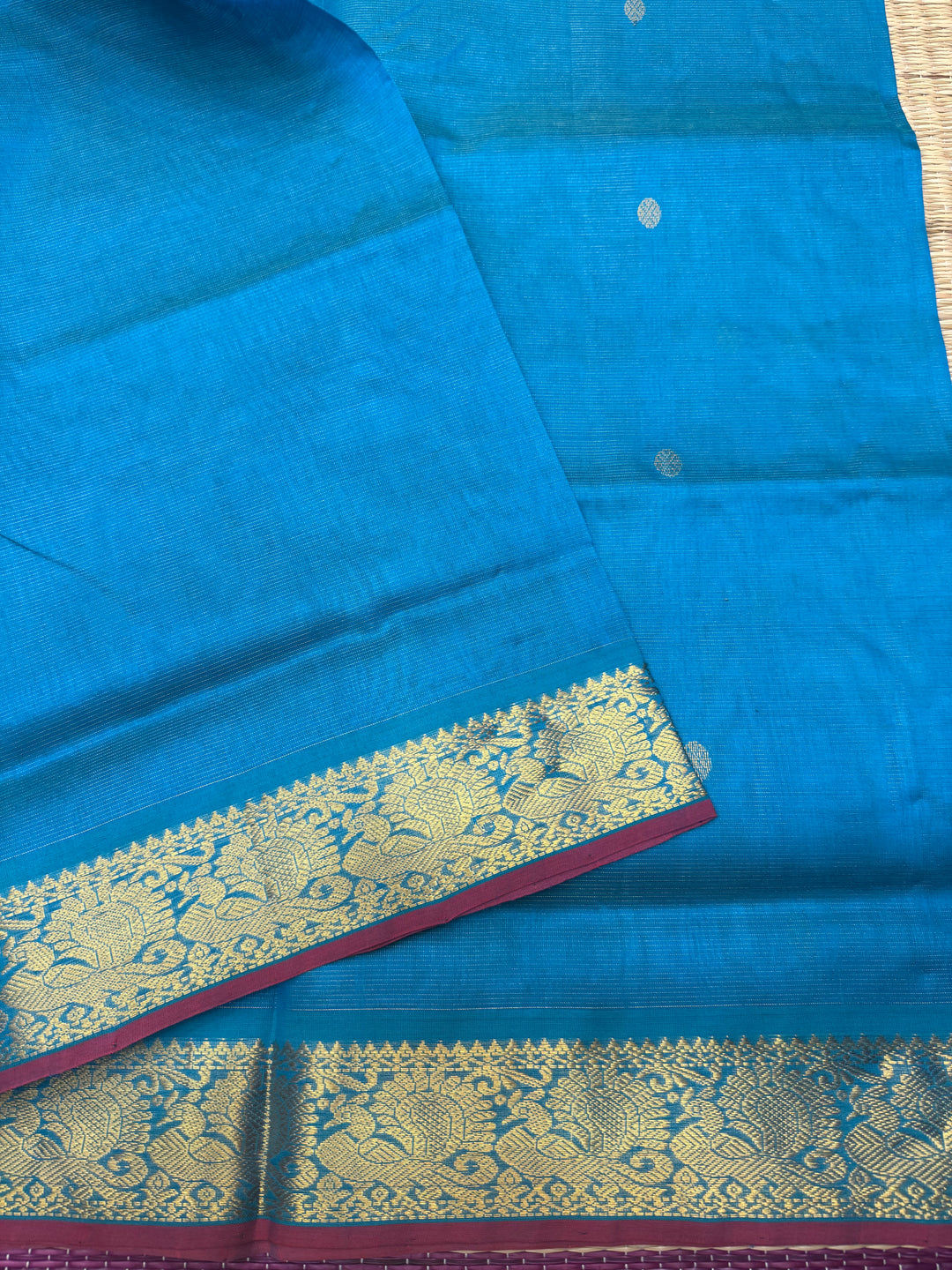 Ramar Blue , Red Selvedge Vairaoosi Zari lines with Rich Rudraksh Zari Butta in the body , traditional borders and Rich Pallu Pure Silk Cotton Saree