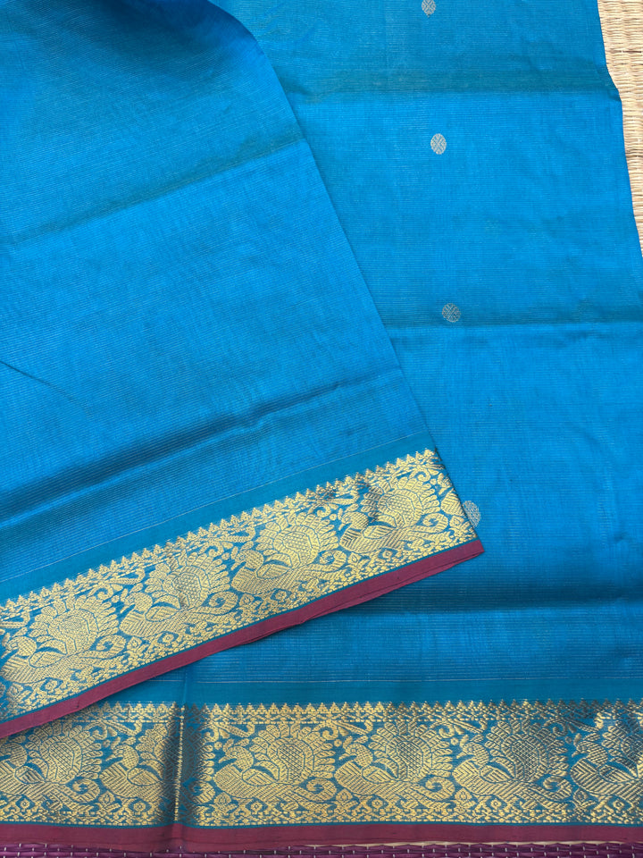 Ramar Blue , Red Selvedge Vairaoosi Zari lines with Rich Rudraksh Zari Butta in the body , traditional borders and Rich Pallu Pure Silk Cotton Saree