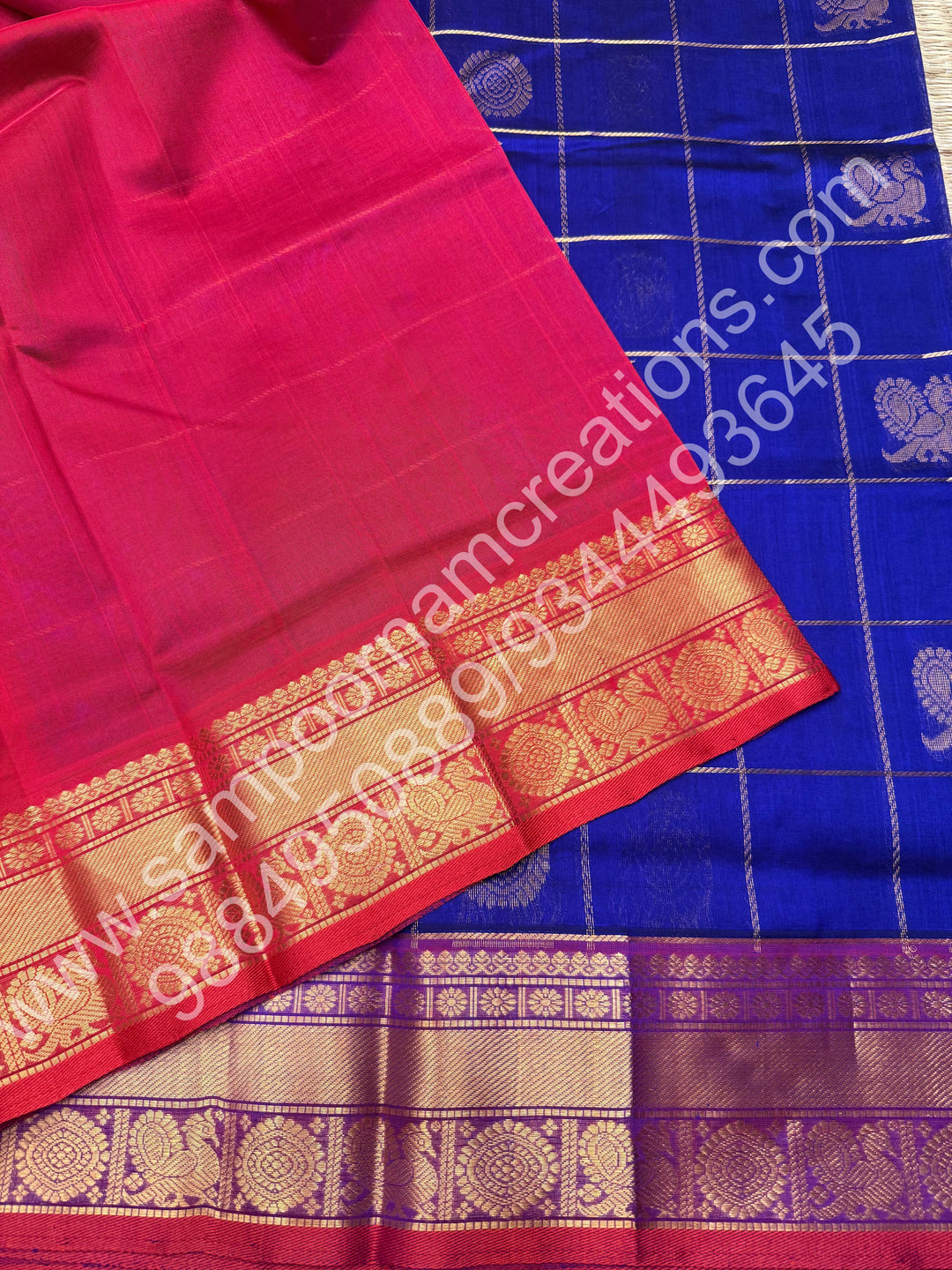 Indigo Blue with Red  , Rich Mayil and Chakram butta in the body with Zari Checks , Traditional borders and Rich Pallu Pure Silk Cotton Saree