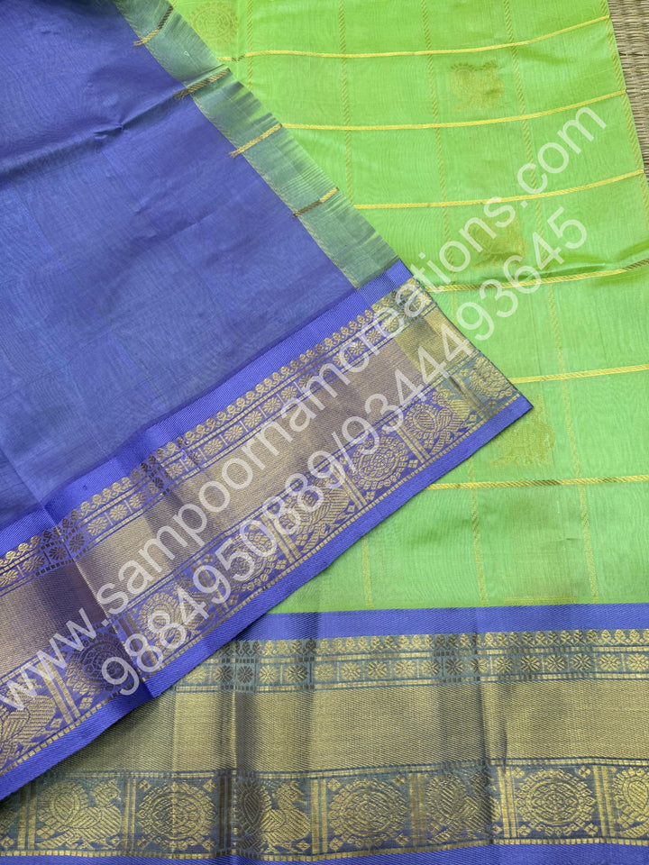 Pastel Green with Lavender  , Rich Mayil and Chakram butta in the body with Zari Checks , Traditional borders and Rich Pallu Pure Silk Cotton Saree