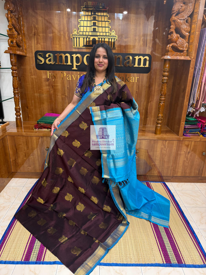 Dark Brown with Turquoise Blue , Annam Zari Butta in the body and traditional border , Rich Pallu Silk Cotton Saree