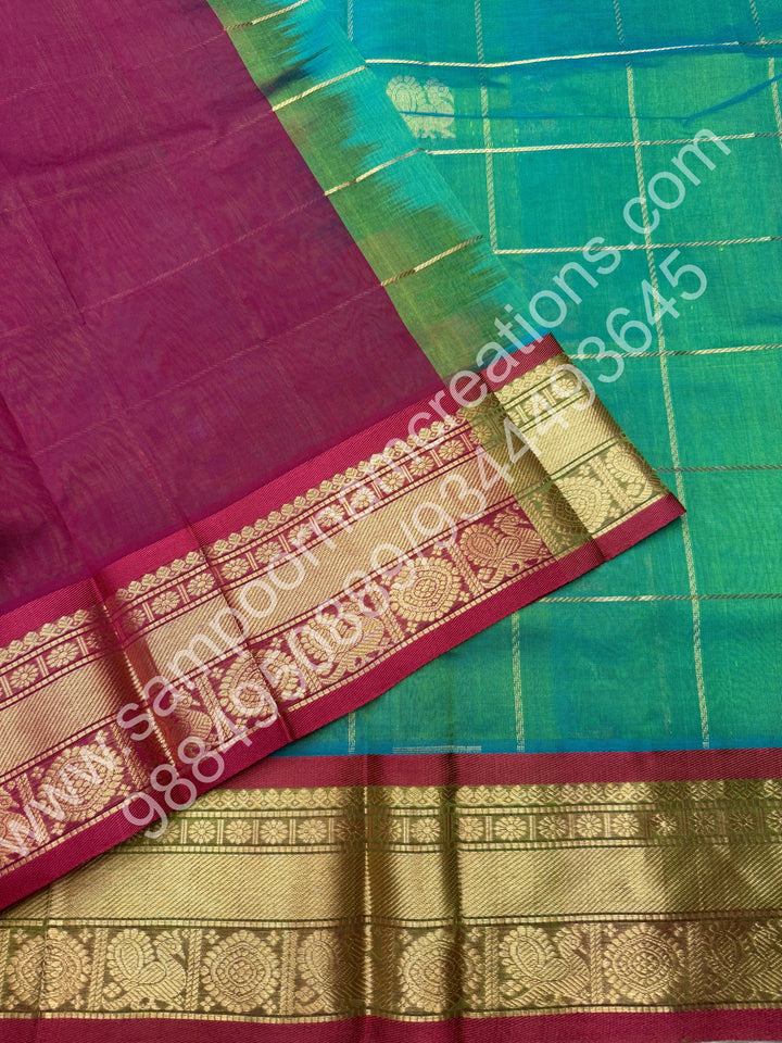 Double Shaded Rexona Green with Maroon  , Rich Mayil and Chakram butta in the body with Zari Checks , Traditional borders and Rich Pallu Pure Silk Cotton Saree