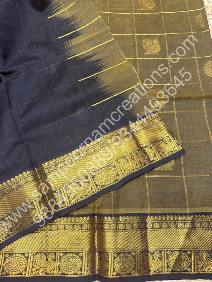 Sage Green with Black , Rich Mayil and Chakram butta in the body with Zari Checks , Traditional borders and Rich Pallu Pure Silk Cotton Saree