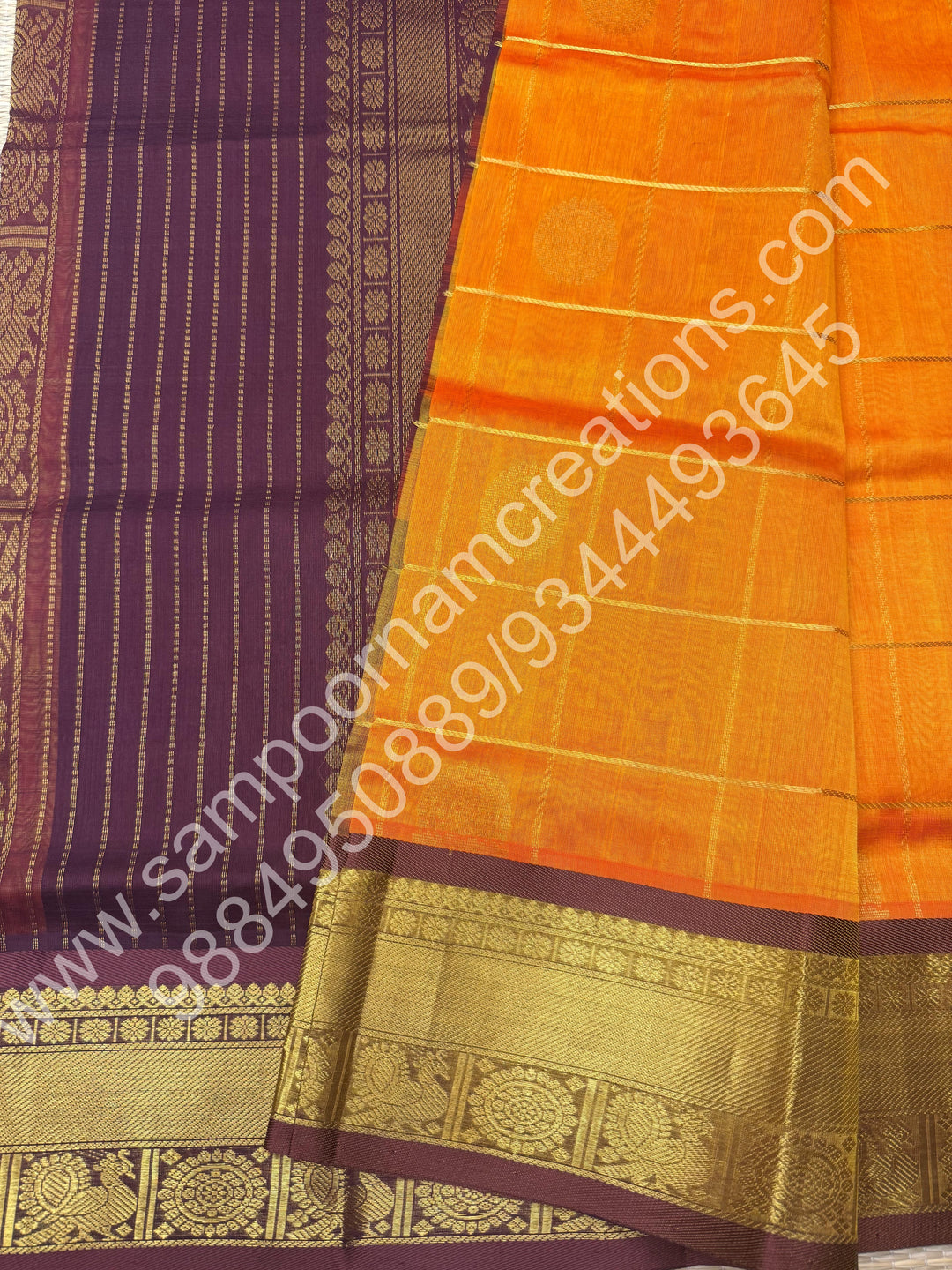 Orange with brown  , Rich Mayil and Chakram butta in the body with Zari Checks , Traditional borders and Rich Pallu Pure Silk Cotton Saree
