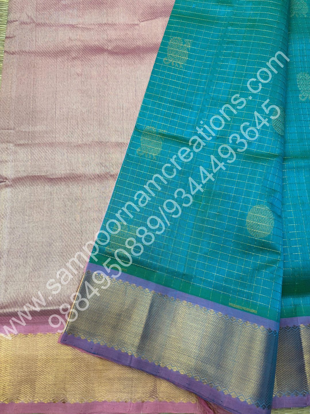 Double Shaded Sea Green with Baby Pink  , Rich Mayil and Chakram butta in the body with Zari Checks , Traditional borders and Rich Pallu Pure Silk Cotton Saree