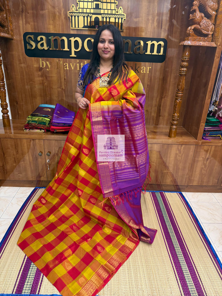 Red , Orange and Mustard with Purple , Mango butta in the body , traditional borders and rich Pallu Silk Cotton Saree