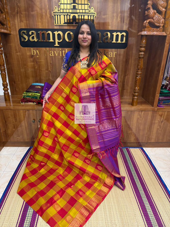 Red , Orange and Mustard with Purple , Mango butta in the body , traditional borders and rich Pallu Silk Cotton Saree