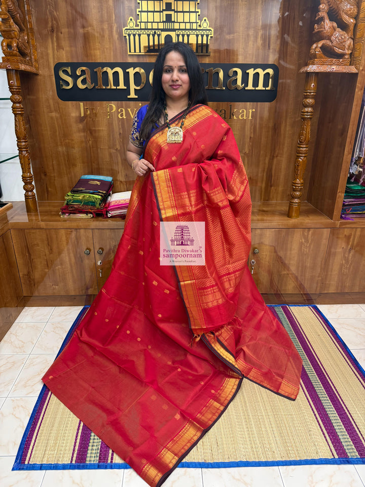 Classic Red , Maroon Selvedge , Annam  Zari Butta and  Vairaoosi Zari lines in the body , traditional borders and rich Pallu Silk Cotton Sarees