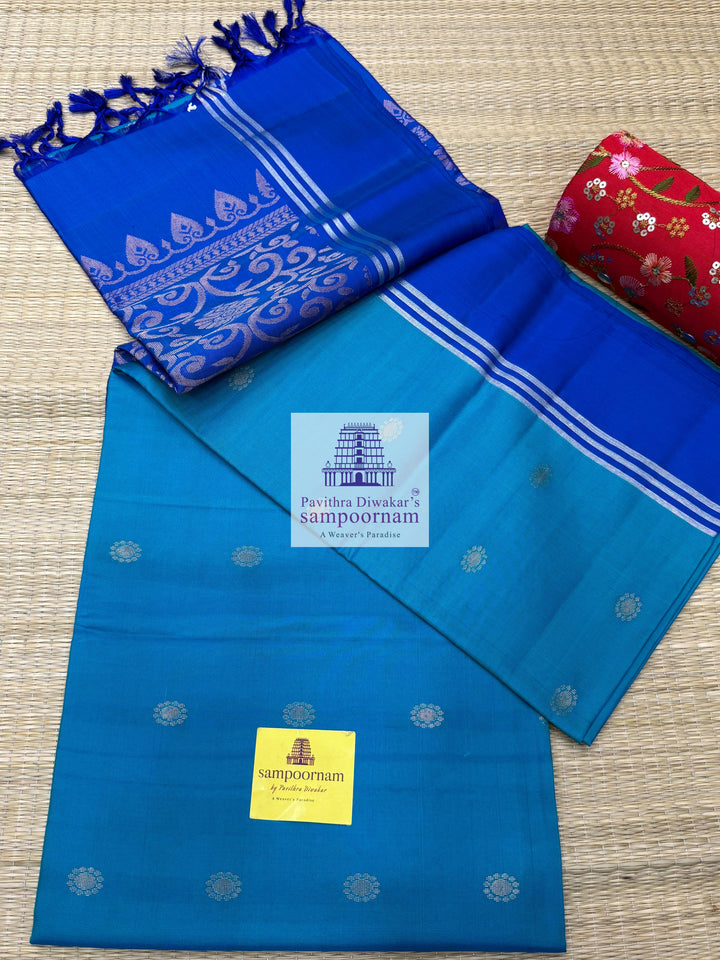Light Blue with Dark Blue , rich Zari Butta in the body , Plain borders , rich Pallu Handloom Semi Soft Silk Saree