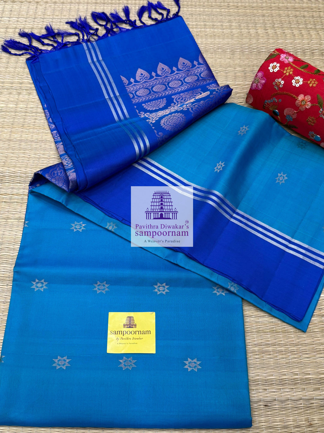 Blue with Dark Blue , rich Zari Butta in the body , Plain borders , rich Pallu Handloom Semi Soft Silk Saree