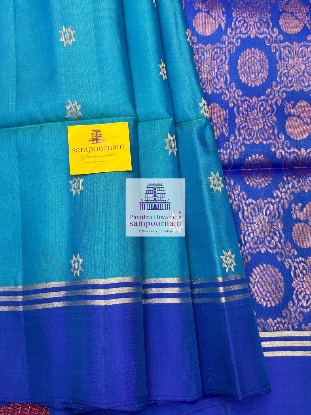 Blue with Dark Blue , rich Zari Butta in the body , Plain borders , rich Pallu Handloom Semi Soft Silk Saree