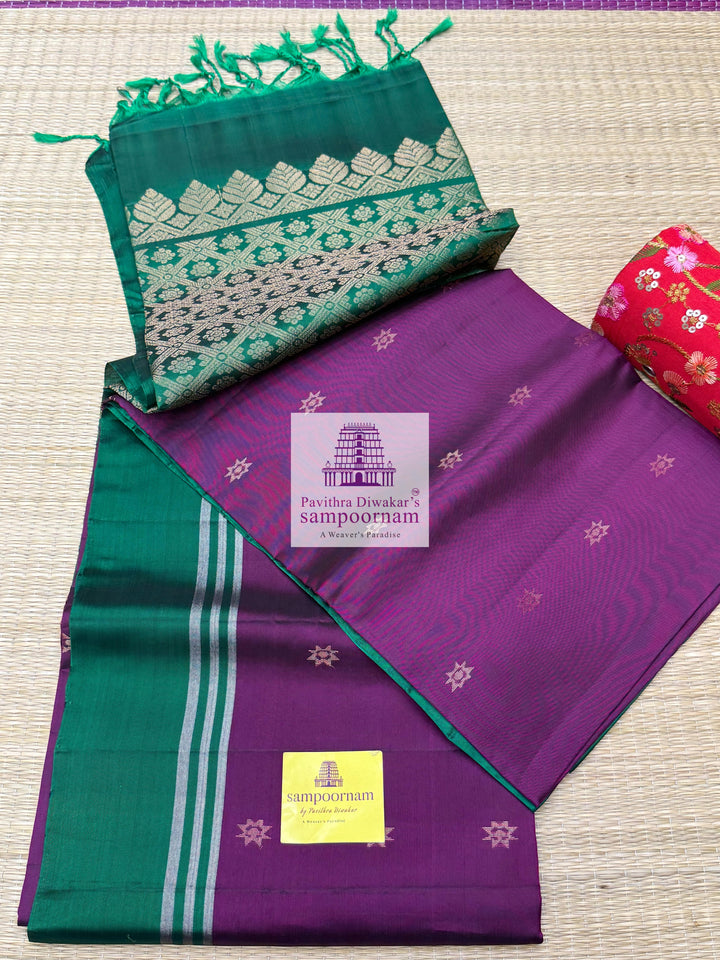 Wine with Green , rich Zari Butta in the body , Plain borders , rich Pallu Handloom Semi Soft Silk Saree