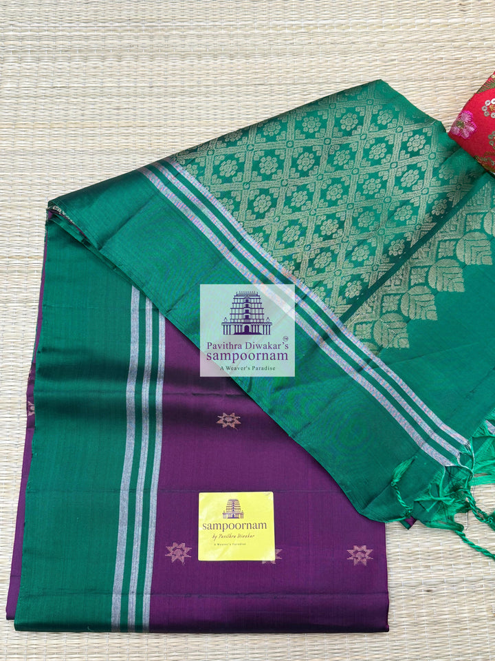 Wine with Green , rich Zari Butta in the body , Plain borders , rich Pallu Handloom Semi Soft Silk Saree