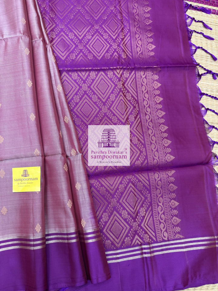Mauve with Purple , rich Zari Butta in the body , Plain borders , rich Pallu Handloom Semi Soft Silk Saree
