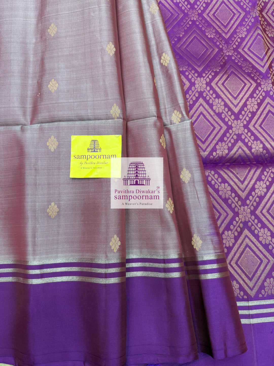 Mauve with Purple , rich Zari Butta in the body , Plain borders , rich Pallu Handloom Semi Soft Silk Saree