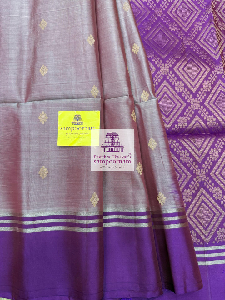 Mauve with Purple , rich Zari Butta in the body , Plain borders , rich Pallu Handloom Semi Soft Silk Saree