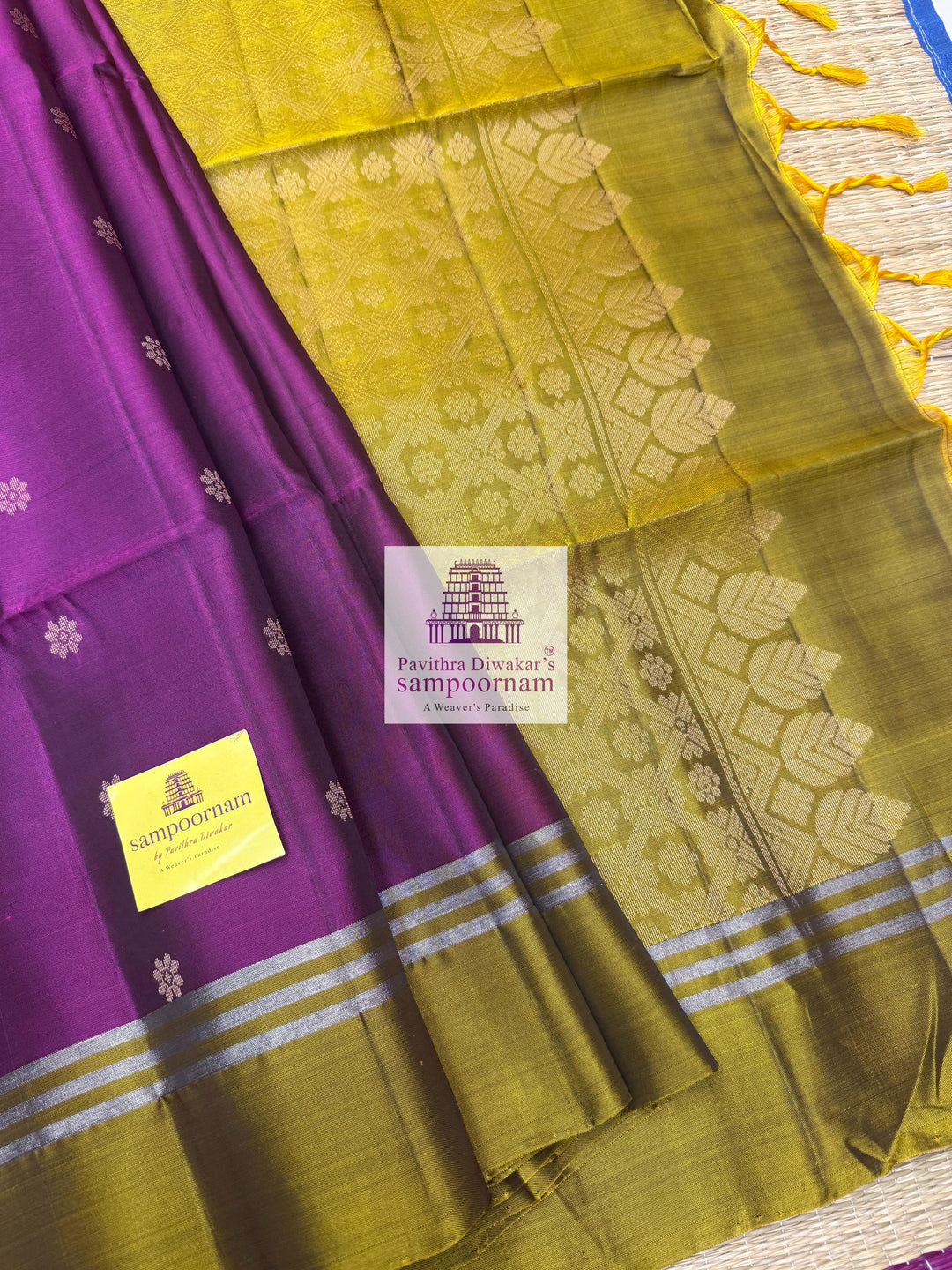 Purple with Mehandi Green , rich Zari Butta in the body , Plain borders , rich Pallu Handloom Semi Soft Silk Saree