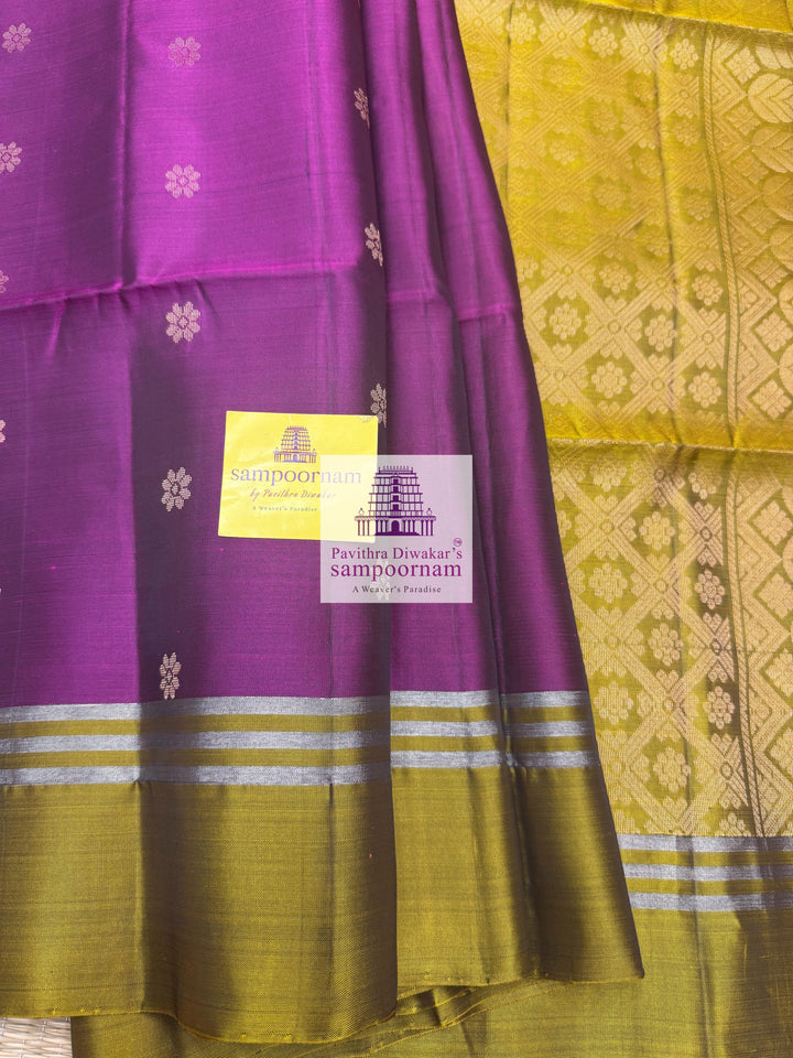 Purple with Mehandi Green , rich Zari Butta in the body , Plain borders , rich Pallu Handloom Semi Soft Silk Saree