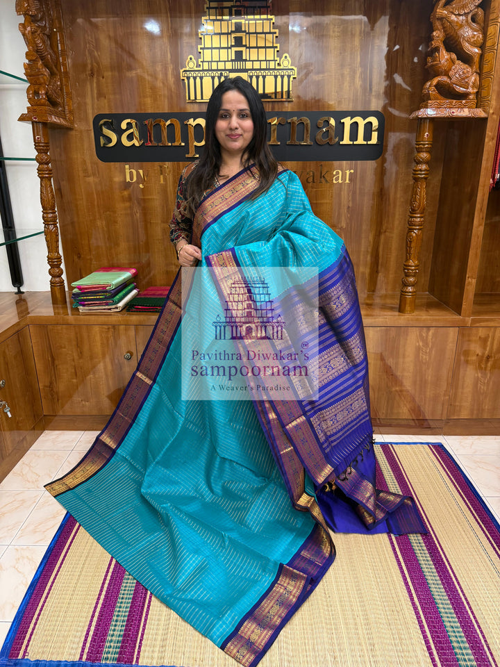 Ramar Blue with Blue  , Zari checks in the body , traditional borders with rich Pallu Korvai Silk Cotton Saree