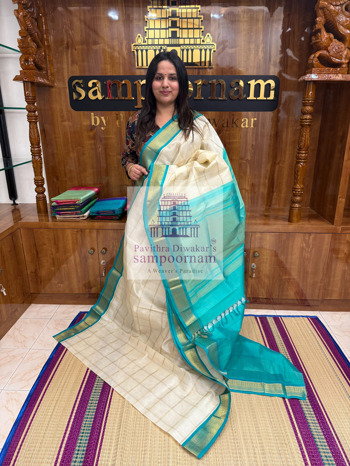 Half White with Turquoise Blue  , Zari checks in the body , traditional borders with richPallu Korvai Silk Cotton Saree