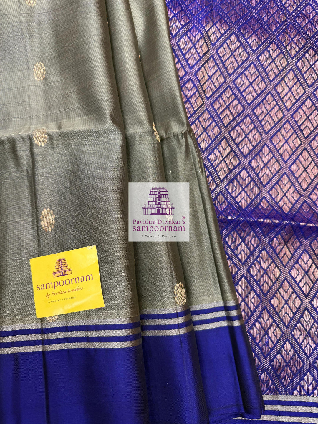 Greenish Grey with Dark Blue , rich Zari Butta in the body , Plain borders , rich Pallu Handloom Semi Soft Silk Saree