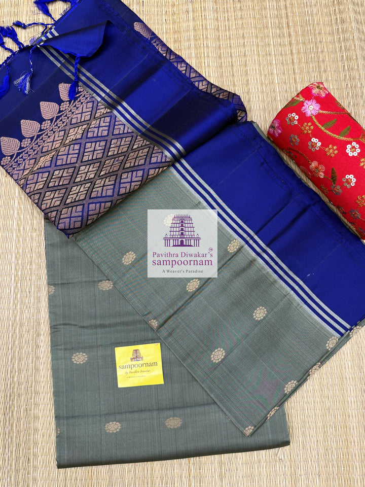 Greenish Grey with Dark Blue , rich Zari Butta in the body , Plain borders , rich Pallu Handloom Semi Soft Silk Saree