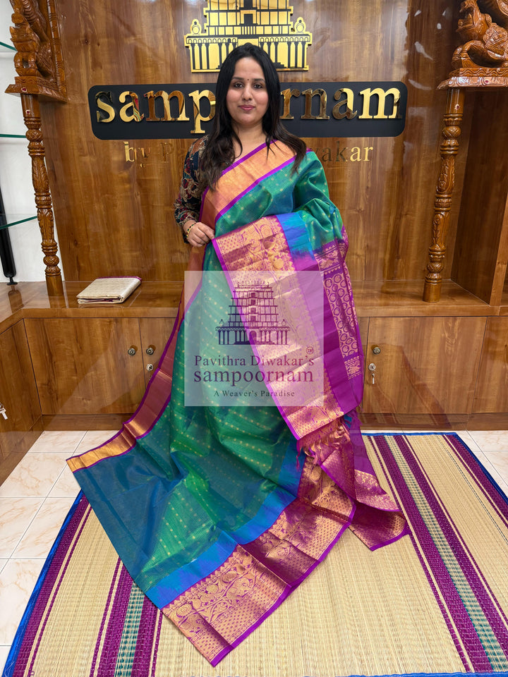 Turquoise Blue with Purple , Zari Podi Kattam in the body , traditional borders and rich Pallu Korvai Silk Cotton Saree