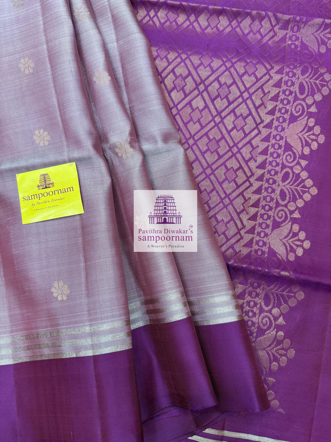 Lavender with Purple , rich Zari Butta in the body , Plain borders , rich Pallu Handloom Semi Soft Silk Saree