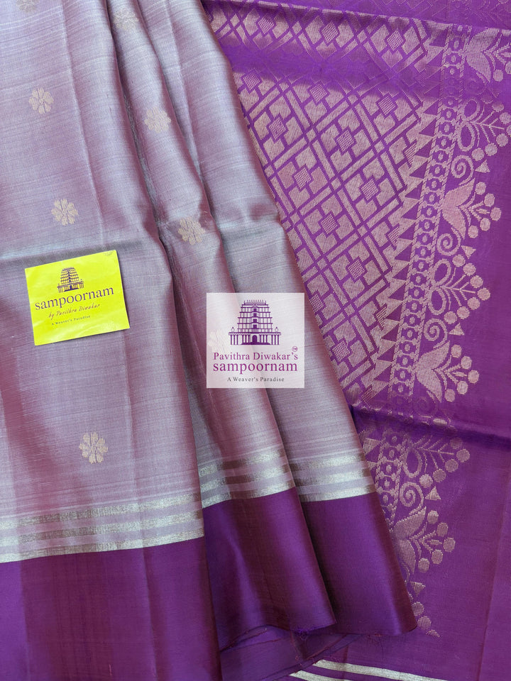 Lavender with Purple , rich Zari Butta in the body , Plain borders , rich Pallu Handloom Semi Soft Silk Saree